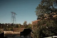 building camera:fujifilm_x100 exterior fence forest orientation:landscape photographer:deaddeaddeath plant power_line sky tree water // 1728x1152 // 442KB