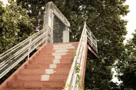 camera:fujifilm_x100 concrete exterior fence ivy metal nature orientation:landscape overgrown photographer:deaddeaddeath plant rust stairs // 1728x1152 // 595KB