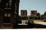apartment brick building camera:fujifilm_x100 cargo_container city exterior orientation:landscape photographer:deaddeaddeath plant sidewalk utility_pole window // 1728x1152 // 234KB