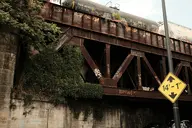billboard brick bridge camera:fujifilm_x100 concrete exterior ivy metal orientation:landscape photographer:deaddeaddeath plant rust train // 1728x1152 // 390KB