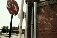 brick building camera:fujifilm_x100 city exterior fence orientation:landscape photographer:deaddeaddeath pipe sign text vehicle wire // 1728x1152 // 224KB